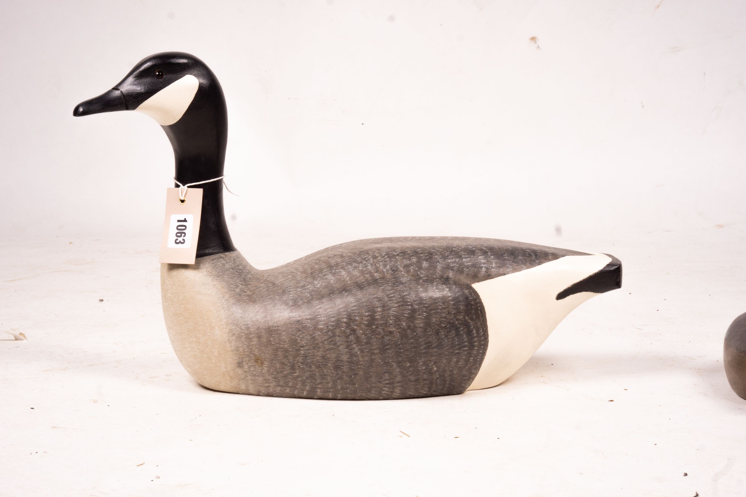 Three American carved and painted decoy duck ornaments, largest 48cm long